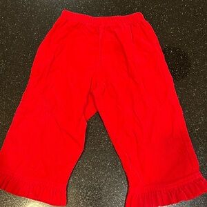 Girls Bailey Boys red corduroy pants with ruffle.